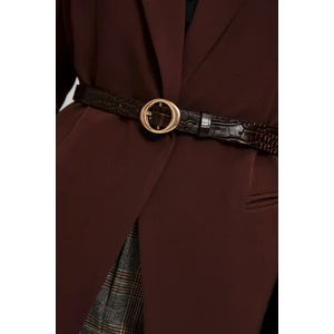 Belt with decorative clasp and snake pattern