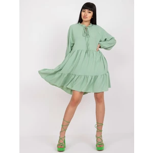 Light green boho style dress with a frill