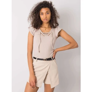 Beige blouse with a laced neckline