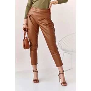 Fashionable brown trousers made of artificial leather for women