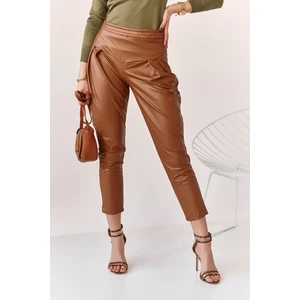 Fashionable brown trousers made of artificial leather for women