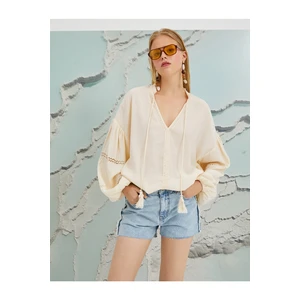 Koton Şahika Ercümen X - Tassel Detailed V-Neck Blouse with Balloon Sleeves.
