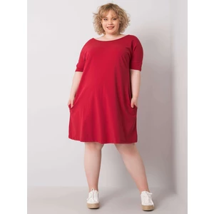 Loose burgundy dress of a larger size