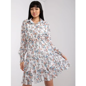 White dress with a floral print and long sleeves