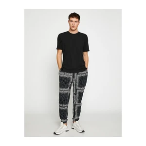 Koton Floral Print Jogger Sweatpants with Lace-Up Waist.