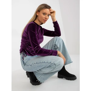 Lady's dark purple velour blouse with hems
