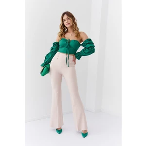 Elegant lady's beige flowing trousers with pleats