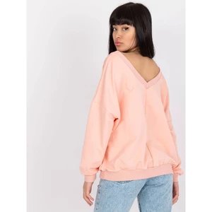 Light pink oversized sweatshirt with a print