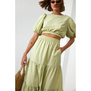 Lady's summer set blouse with a skirt in light khaki color