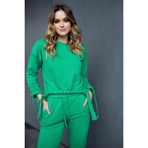 Ordinary women's tracksuit with asymmetrical green sweatshirt