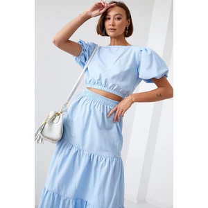 Lady's summer set blouse with a skirt of light blue color