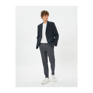 Koton Patterned Woven Trousers with Pockets and Buttons.