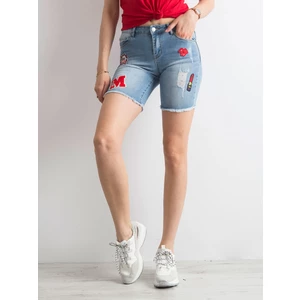 Denim shorts with colorful blue patches