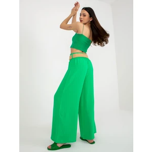 Green wide trousers made of fabric with a belt