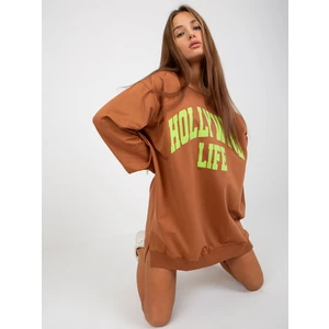 Light brown and green long sweatshirt with inscription