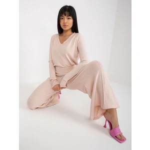 Light pink knitted trousers with wide legs