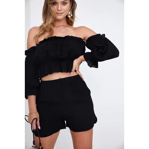 Lady's summer blouse and black shorts