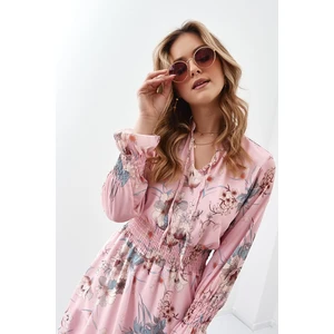 Light powder dress with flowers and ruffles