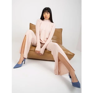 Light pink wide knitted trousers with slit