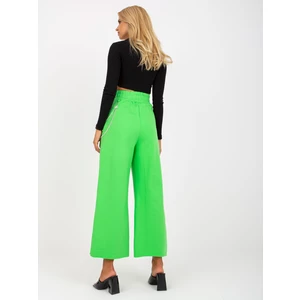 Light green wide sweatpants with holes